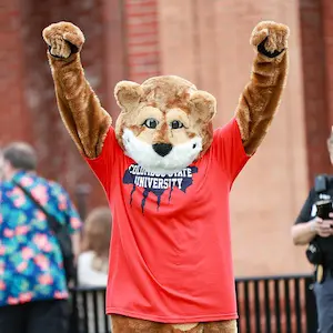 Cody the Cougar holding his arms up