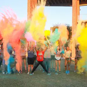 students having fun playing in a color party