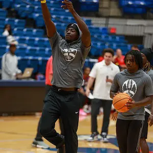 Students shooting hoops at Cougar Madness during Homecoming week