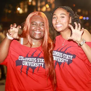 2 female student in CSU t-shirts