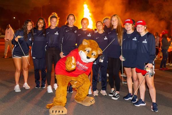 Students with Cody the Cougar at the Homecoming Bonfire